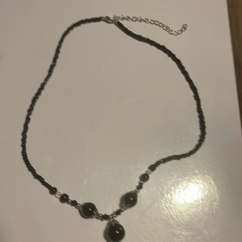 Black beaded necklace
Silver tone